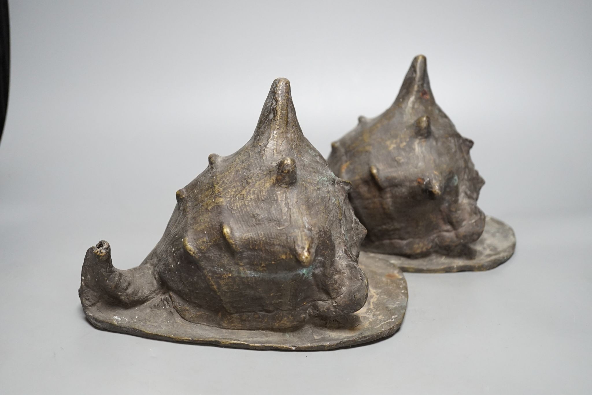 A pair of spelter conch shells, 24cm